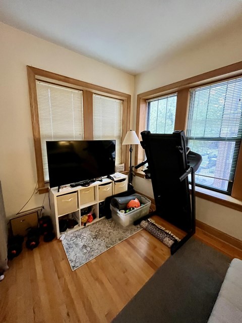 a living room with a tv and a couch in it